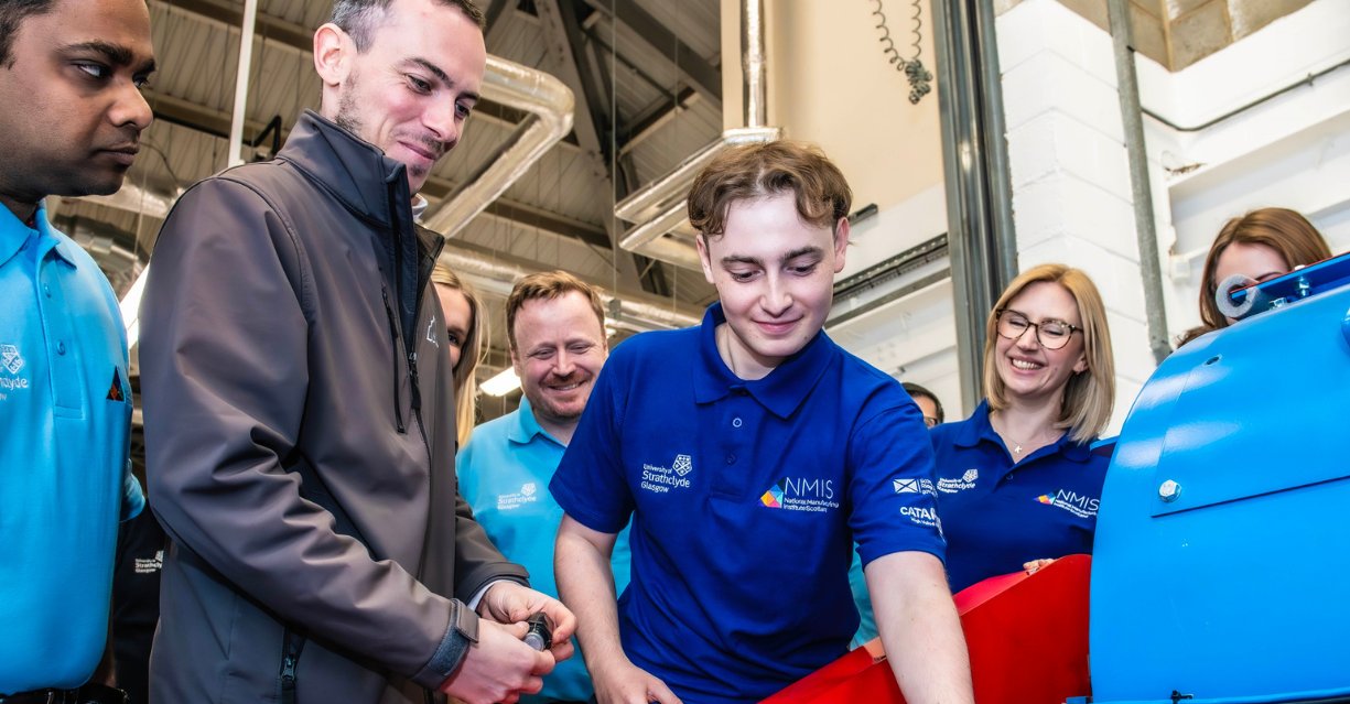 A group of engineers inspecting digital equipment